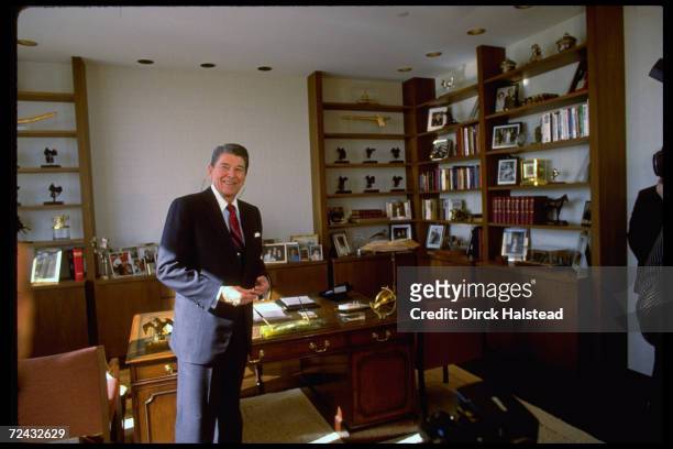 Former US President Ronald Reagan standing in his new Century City office.