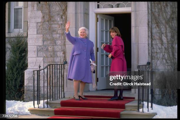 First Lady Barbara Bush on red carpeted steps with Mila Mulroney wife of Canadian PM.