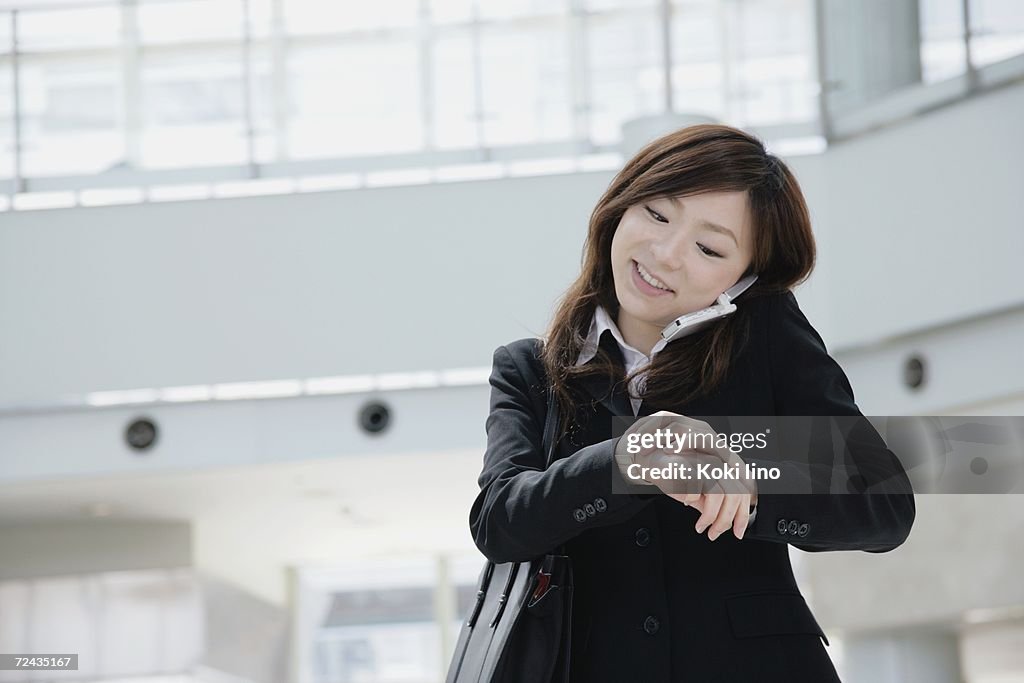 A young woman talking over mobile phone