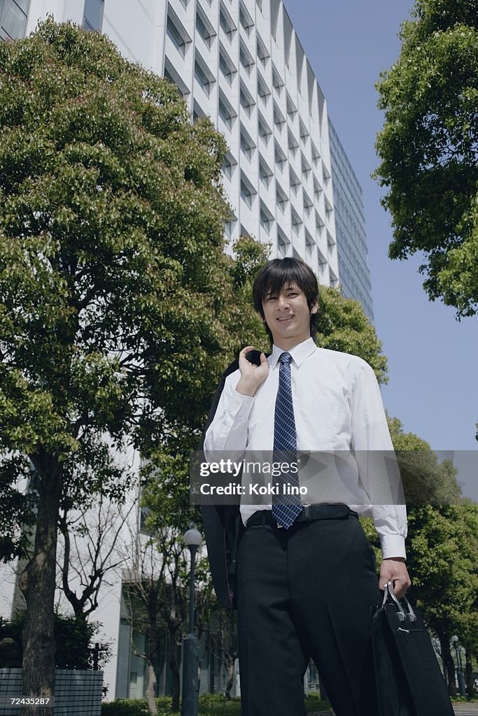 A young man in suit standing