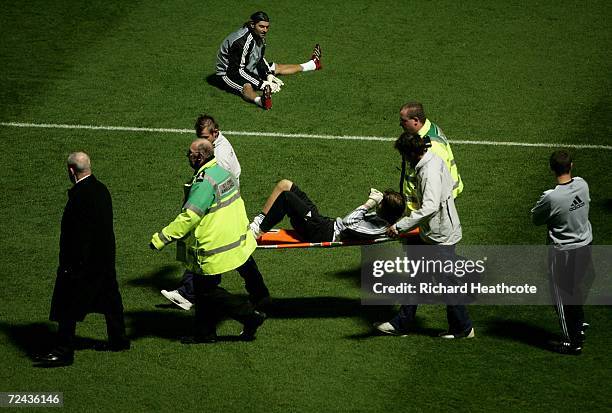 Goalkeeper Tim Krul of Newcastle United is carried off by medical staff after he injured himself in the warm-up during the Fourth Round Carling Cup...