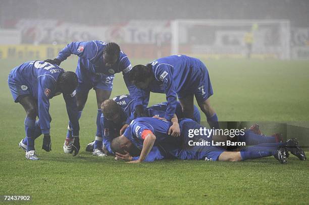 Christopher Lamprecht of Wolfsburg celebrates scoring the third goal with team mates during the Bundesliga match between FSV Mainz 05 and VFL...