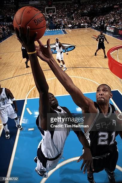 DeSagana Diop of the Dallas Mavericks shoots past Tim Duncan of the San Antonio Spurs during the game at American Airlines Center on November 2, 2006...
