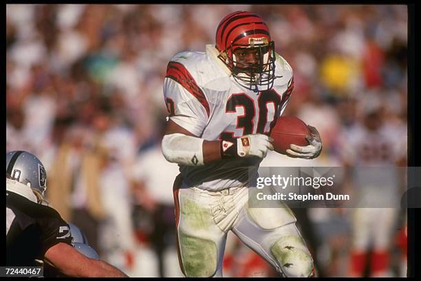 Running back Ickey Woods of the Cincinnati Bengals moves the ball during a playoff game against the Los Angeles Raiders at the Coliseum in Los...