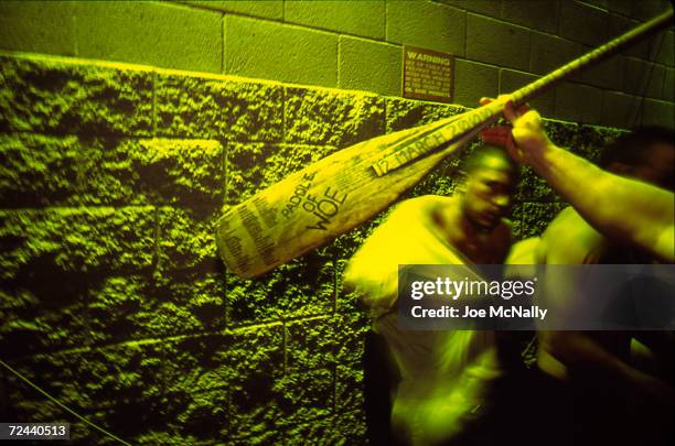 Navy Seal trainee is whacked with the "Paddle of Woe" in this undated photo taken in 2000 at the Coronado Naval Amphibious Base in San Diego,...