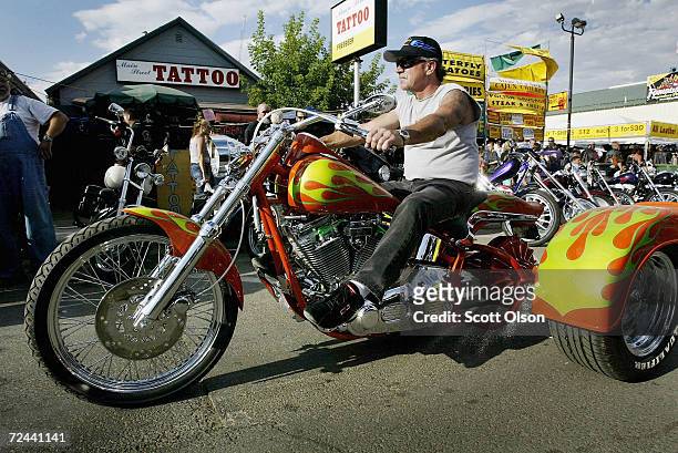 Biker on a trike rides through downtown Sturgis during the start of the annual Sturgis Motorcycle Rally August 4, 2003 in Sturgis, South Dakota. The...