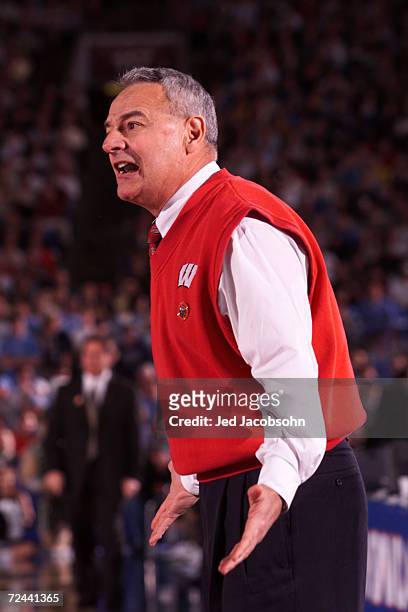 Head coach Dick Bennett of Wisconsin shouts out instructions to his team during the semifinal round of the NCAA Final Four against Michigan State at...