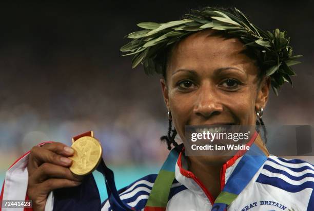 Gold medalist Kelly Holmes of Great Britain celebrates on the podium during the medal ceremony of the women's 1,500 metre event on August 28, 2004...