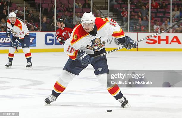 Ville Peltonen of the Florida Panthers winds up to shoot against the New Jersey Devils during their game at the Continental Airlines Arena on October...