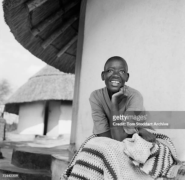 Chipo Maponga pictured at home in the Glendale area of Zimbabwe. Chipo contracted HIV while working as a teacher in Harare and returned to her home...