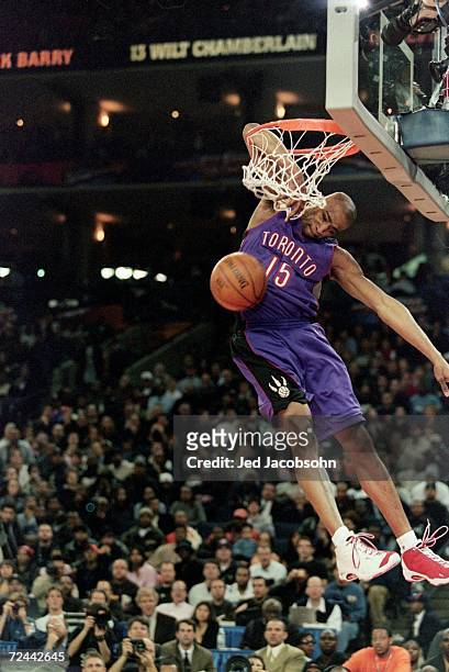 Vince Carter of the Toronto Raptors jumps to make the slam dunk during the NBA Allstar Game Slam Dunk Contest at the Oakland Coliseum in Oakland,...