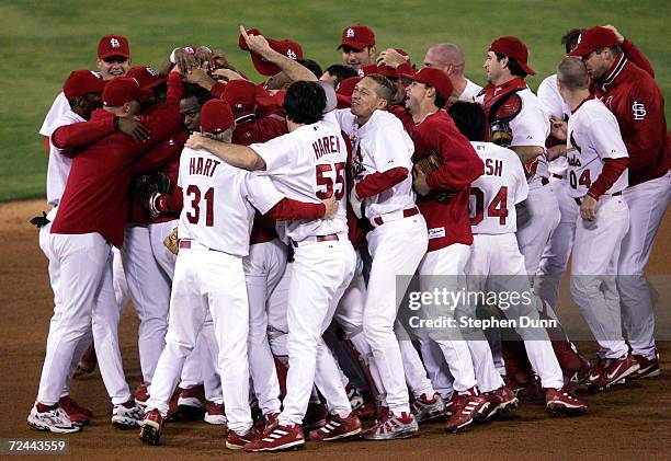 The St. Louis Cardinals celebrate after defeating the Houston Astros 5-2 in game seven of the National League Championship Series during the 2004...