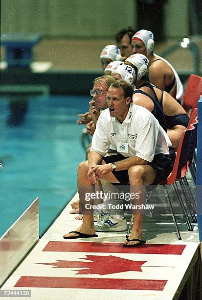 Head coach Guy Baker of Team USA looks on from pool side during the FINA World Cup against Team Australia at the Pan Am Pool in Winnepeg, Canada....