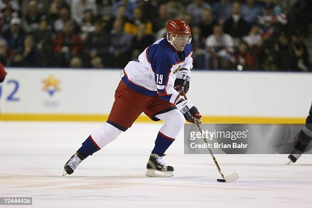 Alexei Yashin of Russia skates with the puck during the men's semifinals at the Salt Lake City Winter Olympic Games at the E Center in Salt Lake...