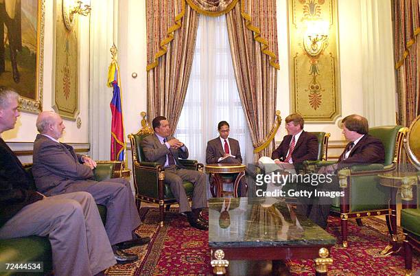 Venezuelan President Hugo Chavez talks with U.S. Senator Gene Taylor during a meeting at the Miraflores presidential palace February 19, 2002 in...