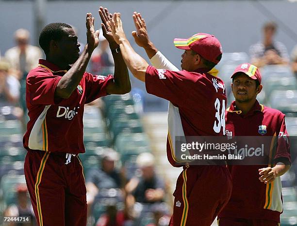 Reon King and Riccardo Powell of the West Indies celebrate the wicket of Yasir Hameed of Pakistan during game nine of the VB Series One Day...