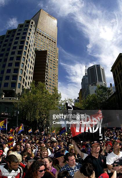 Brisbane Lions and Essendon Bombers fans celebrate their teams arrival, during the 2001 AFL Grand Final Parade. Melbourne, Australia. DIGITAL IMAGE...