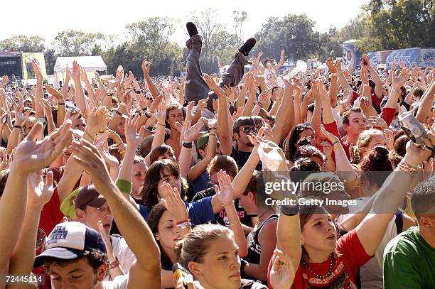 The audience claps during a performance by Sugarcult at the Voodoo Music Experience 2004 Day One on October 16, 2004 in New Orleans, Louisiana.