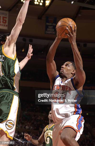 Kurt Thomas of the New York Knicks takes the ball to the basket during a game against the Seattle SuperSonics at Madison Square Garden in New York,...