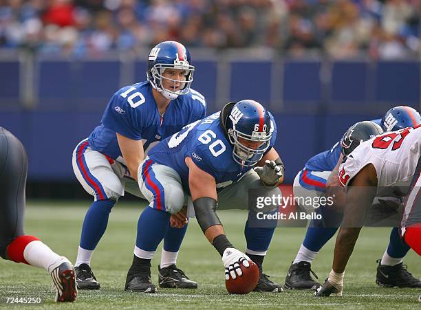 Quarterback Eli Manning the New York Giants gets ready to hike the ball from Shaun O'Hara during the NFL game against the Houston Texans on November...