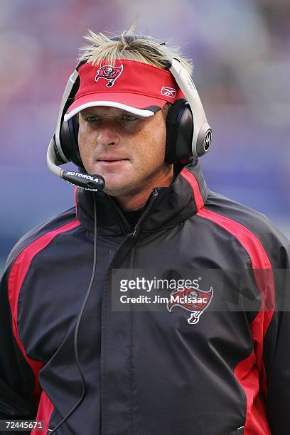 Head coach John Gruden of the Tampa Bay Buccaneers coaches from the sidelines against the New York Giants on October 29, 2006 at Giants Stadium in...