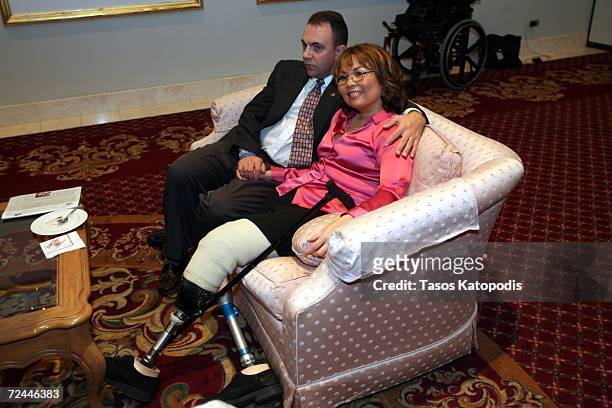 Democratic candidate Tammy Duckworth and her husband Bryan Bowlsbey watch election returns on November 7, 2006 in Oakbrook, Illinois. Duckworth, a...