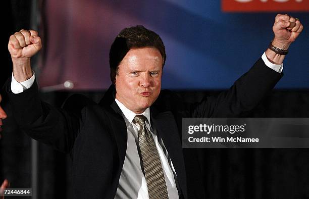 Democratic U.S. Senate candidate Jim Webb pumps his fists onstage during an election night party November 7, 2006 in Vienna, Virginia. Webb's race...