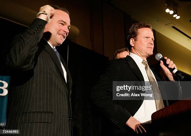 Democratic U.S. Senate candidate Jim Webb speaks to supporters as current Virginia Gov. Tim Kaine holds up his fist during an election night party...