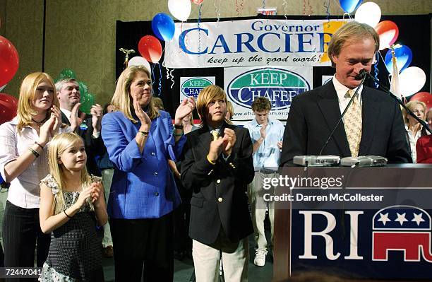 Senator Lincoln D. Chafee smiles while giving a concession speech as daughters Louisa, , Thea, wife Stephanie and son Caleb applaud at the Crowne...