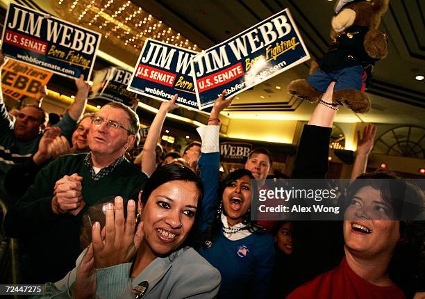 Supporters cheer as they watch the latest results showing Democratic U.S. Senate candidate Jim Webb is up during an election nigth party November 7,...