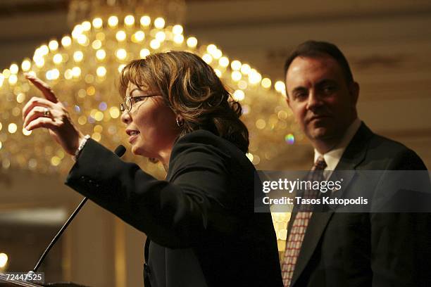 Tammy Duckworth concedes the Sixth District Congressional seat to Republican Peter Roskam as her husband Bryan Bowlsbey listens on November 7, 2006...