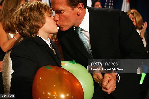 California Governor Arnold Schwarzenegger kisses his son Christopher as he celebrates his victory over Democrat Treasurer Phil Angelides on Election...