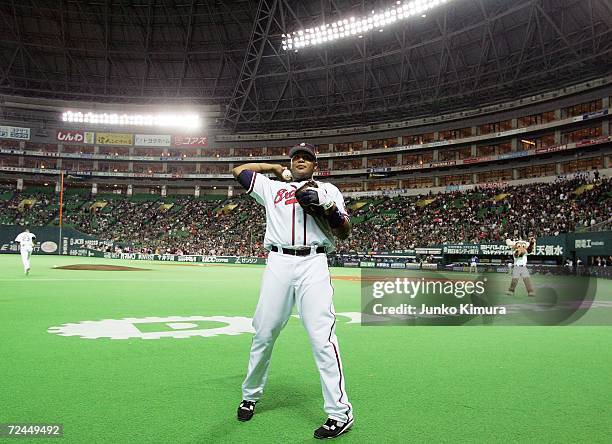 Andruw Jones of the Atlanta Braves throws autographed balls during the Aeon All Star Series Day 5 - MLB v Japan All-Stars at Fukuoka Yahoo! Japan...