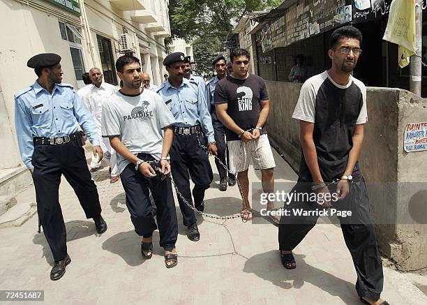 Convicted killers Zeeshan Shahid , Imran Shahid and Mohammed Faisal Mushtaq leave an extradition hearing on August 26, 2005 in Islamabad Pakistan....