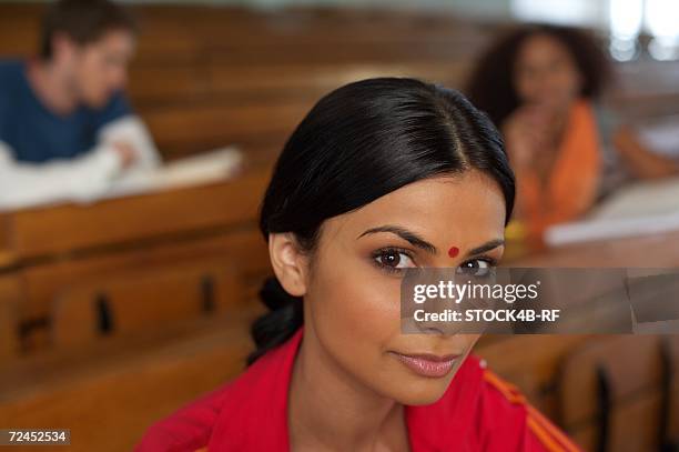 young indian woman in an auditory, close-up, selective focus - university asian students international portrait stock pictures, royalty-free photos & images