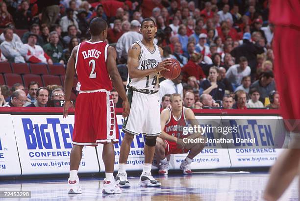 Charlie Bell of Michigan State and Travon Davis of Wisconsin in action during the Big Ten Tournament at the United Center in Chicago,Illinois....