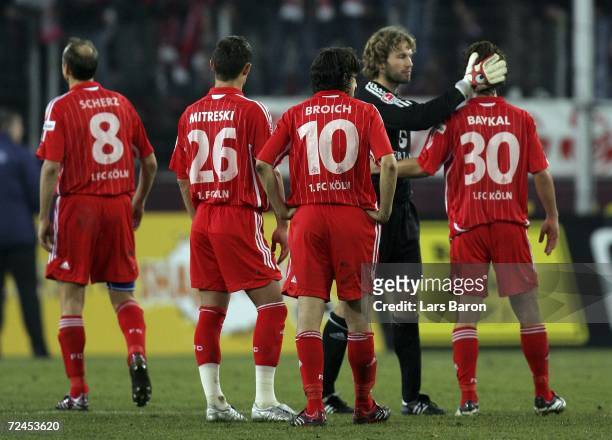 The Cologne players stand on the pitch after loosing the Second Bundesliga match between 1. FC Cologne and Erzgebirge Aue at RheinEnergie Stadium on...