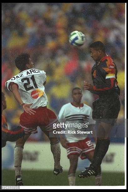 Raul Diaz Arce of DC United and Robin Fraser of the Los Angeles Galaxy fight for the ball during the Major League Soccer MLS Championship game at...