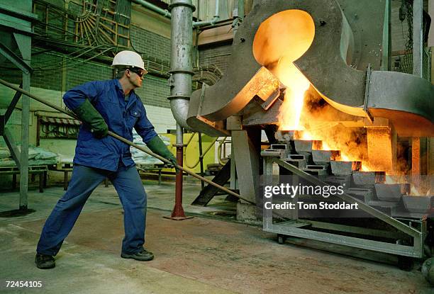 Mine worker pours Gold at the Driefontein Gold Mine near Carltonville, South Africa. The mine is owned by Gold Fields Ltd who are the fourth largest...