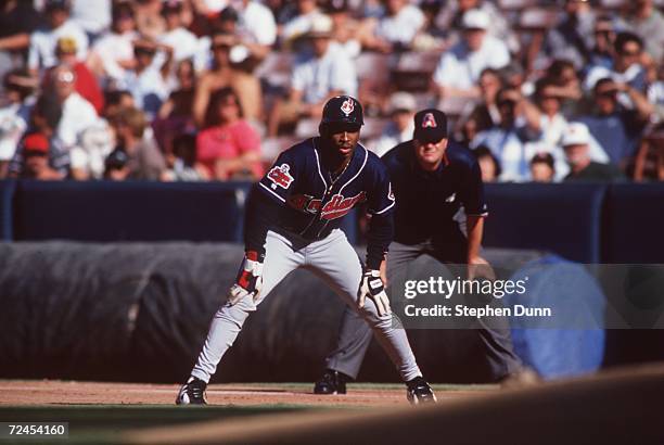 Centerfielder Kenny Lofton of the Cleveland Indians waits at first base during the Indians 4-1 win over the California Angels at Anaheim Stadium in...