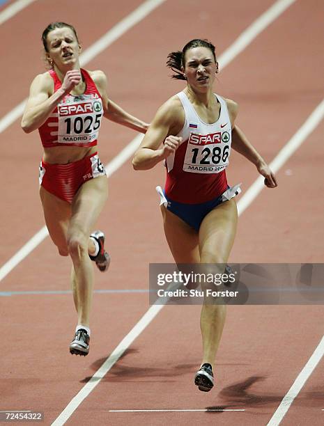 Svetlana Pospelova of Russia beats Svetlana Usovich of Bulgaria to win the womens 400m during the second day of the European Indoor Athletics...