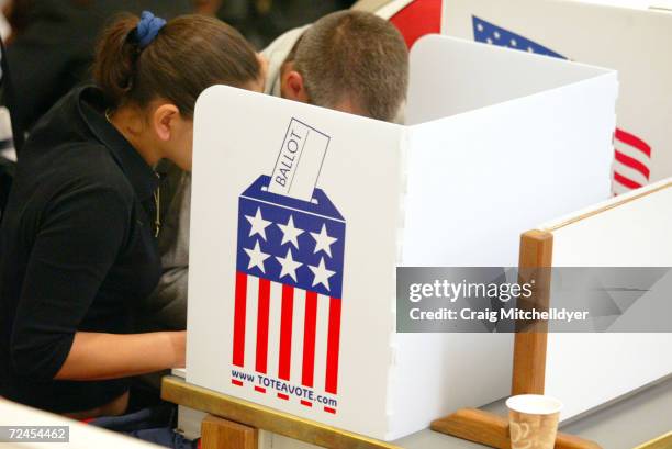 Oregon voters cast their ballots at the Multnomah County elections office on November 2, 2004 in Portland, Oregon. Voters who did not receive ballots...