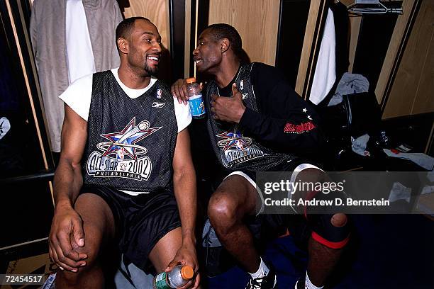 Alonzo Mourning of the Miami Heat and Dikembe Mutombo of the Philadelphia 76''ers in the locker room before the 2002 NBA All Star Game at the First...