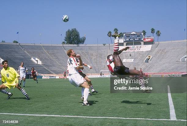 Forward Dante Washington of the Dallas Burn is caught in mid jump as he attempts a bicycle kick during a run on goal in the Burn's 2-1 Major League...