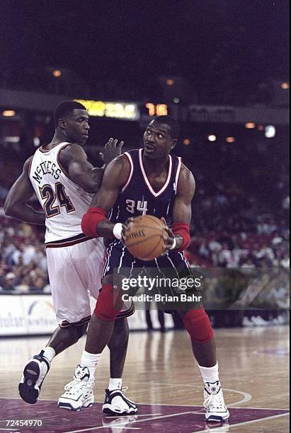 Hakeem Olajuwon of the Houston Rockets about to go up for a shot during the game against the Denver Nuggets at the McNichols Arena in Denver,...