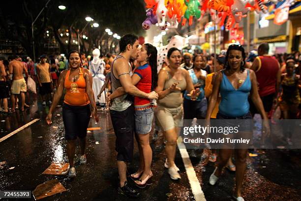 Couple kisses in the rain during Carnival on February 8, 2005 in Salvador, Brazil. Centuries of slave trade with Central and West Africa has left 40...