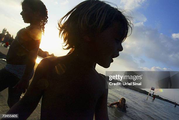 Tourist children play at a Mediterranean beach at the Israeli coastal town of Netanya, a target of many Palestinian suicide attacks in the past 4...