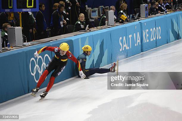 Steven Bradbury of Australia falls in the Men's 1500m Short Track Speed Skating heats during the Salt Lake City Winter Olympic Games at the Salt Lake...