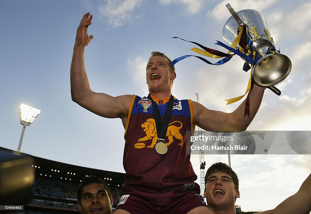 Michael Voss for Brisbane celebrates with the cup