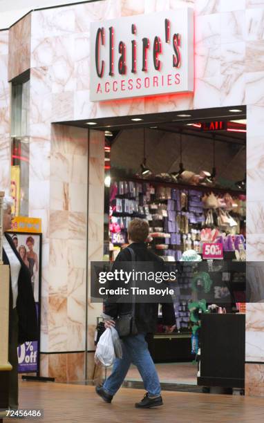 Shopper walks past a Claires Accessories store March 13, 2002 at Golf Mill Shopping Mall in Niles. IL. The U.S. Commerce Department reported March...